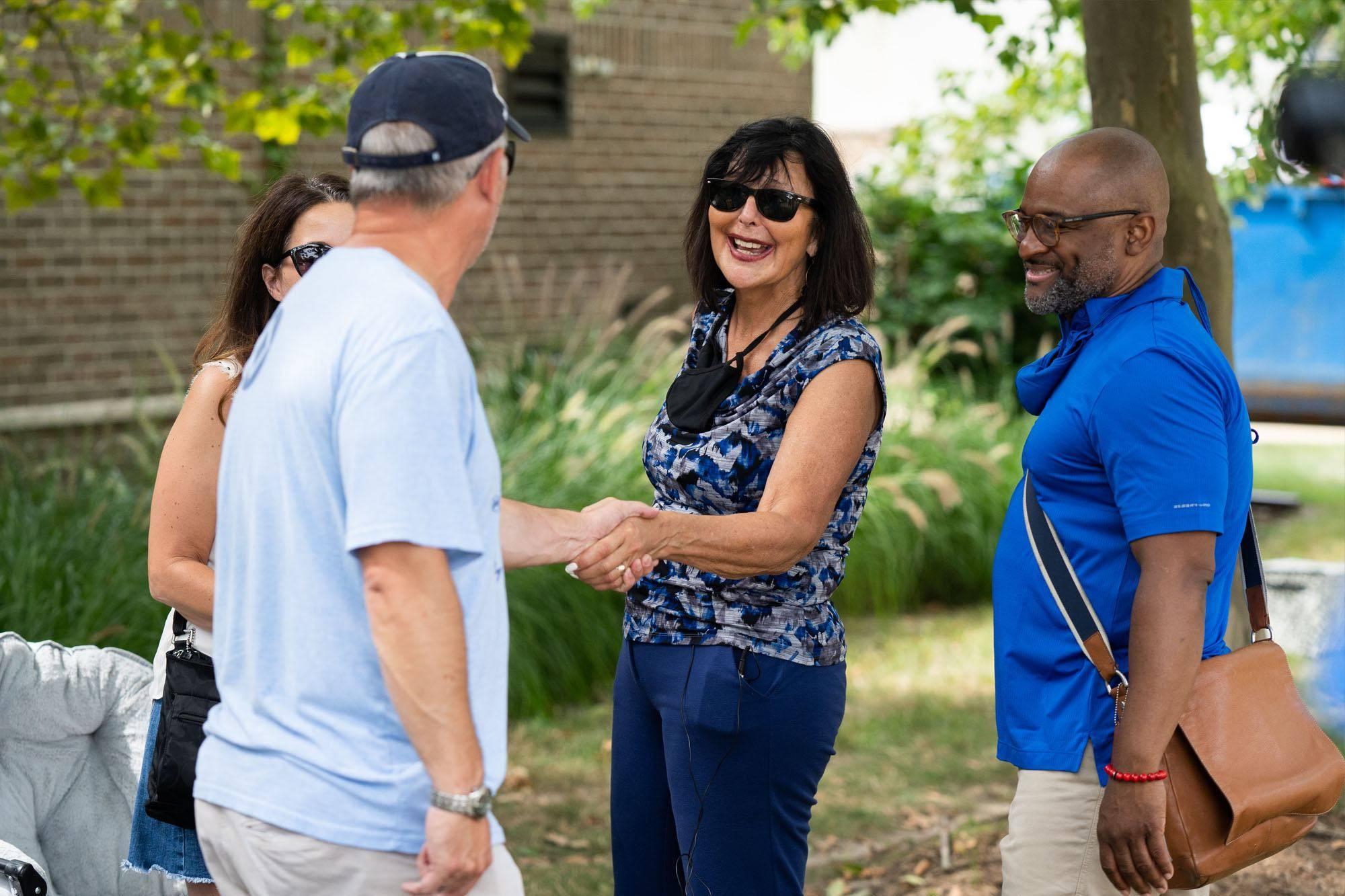 President Philomena V. Mantella and B. Donta Truss, left, vice president for Enrollment Development and Educational Outreach, greet students and their supporters during move-in.